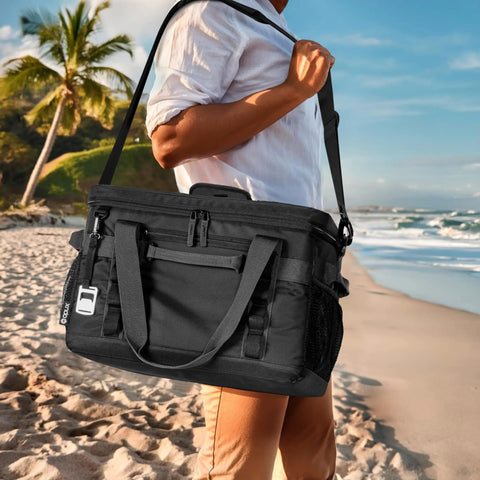 Epically Spacious Collapsible Soft Cooler Bag, 60 Can Leakproof Insulated Tote being carried at a beach.
