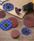 Heavy Duty Aluminum Oxide Sanding Discs For Die Grinders 3 Inch 180 Grit 20 Pack displayed on a workbench with a drill.