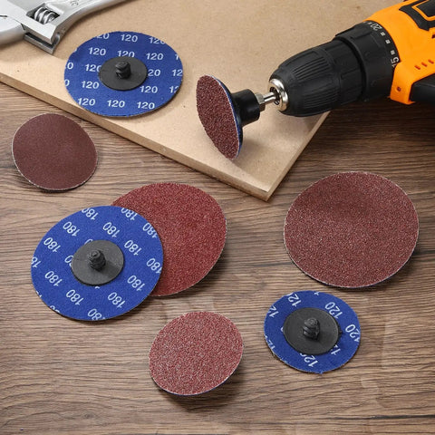 Heavy Duty Aluminum Oxide Sanding Discs For Die Grinders 3 Inch 180 Grit 20 Pack displayed on a workbench with a drill.