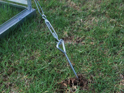 Heavy Duty Ground And Foundation Anchor Kit For Canopia Nature Greenhouses And Skylight Sheds Keeps Your Structure Steady In High Winds With Easy Top Mount Installation Compatible With Canopia Nature Series in use on grass.