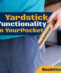 Person placing Folding Ruler With Brass Slide Rule For Carpenters And Tradesmen in pocket, text 'Yardstick Functionality In Your Pocket'