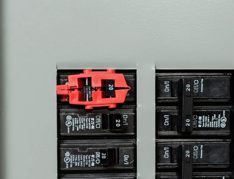 120V Snap On Breaker Lockout Red Pack Of 6 For Electrical Safety, shown installed on a 20 amp circuit breaker