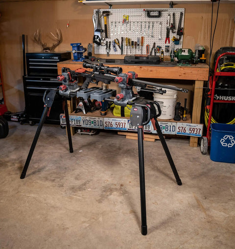 All Purpose Ultra Gun Vise With Adjustable Setup And Universal Maintenance Stand For Firearm Cleaning Featuring Steel Frame Non Marring Nylon Clamps And Removable Accessory Trays For Fast No Fuss Setup And A Collapsible Design For Easy Transport