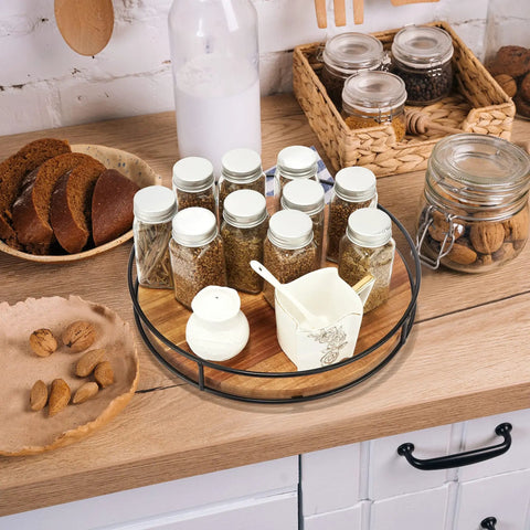 12 Inch Acacia Wood Lazy Susan Turntable With Steel Sides A Solid Kitchen Organizer For Condiments Spices Or Bakeware 360 Degree Rotating Stand For Countertop Cabinet Or Dining Table With Non Slip Base Black displaying spice jars on kitchen counter
