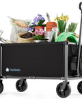 Heavy Duty Collapsible Wagon Cart With 29.3 Inch Body 150L Capacity And 260 Lb Load Beastly Rolling Cart For Garden Groceries Sports Gear Camping Black loaded with gardening tools and pots
