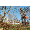 Man using 3 In 1 Backpack Leaf Blower Vacuum Mulcher With PowerBoost 250 MPH Airflow And 400 CFM For Lawn Care in garden