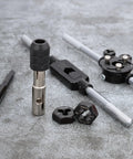 76 Piece Tap And Die Set For External And Internal Threads Rethreading Cutting And Repair Tool on gray surface