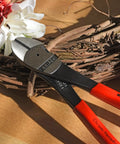 High Leverage Angled Diagonal Cutters 8 Inch with red handles, on wooden surface with floral background