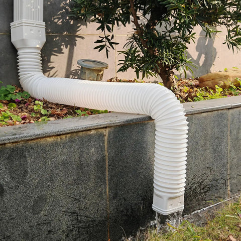 Two Pack Flexible Rain Gutter Downspout Extensions Extendable From 21 To 60 Inches in use diverting water from building