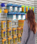 1 Inch Slatwall Deluxe Hooks For Panels Black Finish Pack Of 96 on display with stationery items in retail setting