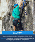 Climber using Four Step Nylon Aider Ladder with Tubular Webbing for tree work and rock climbing on rough terrain.
