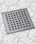 4x4 Inch Square Shower Drain Grate Built In Stainless Steel That Is Corrosion Resistant And Features A Self Cleansing Sloped Channel