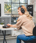 Person using iD4 MkII Audio Interface With Class A Mic Preamps, USB C High Speed, in home studio setting