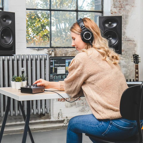 Person using iD4 MkII Audio Interface With Class A Mic Preamps, USB C High Speed, in home studio setting