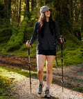 Woman hiking in Women's UV Protection Sun Shirt With UPF 50+ Long Sleeve Lightweight Quick Dry Moisture Wicking Top, Black, Size M
