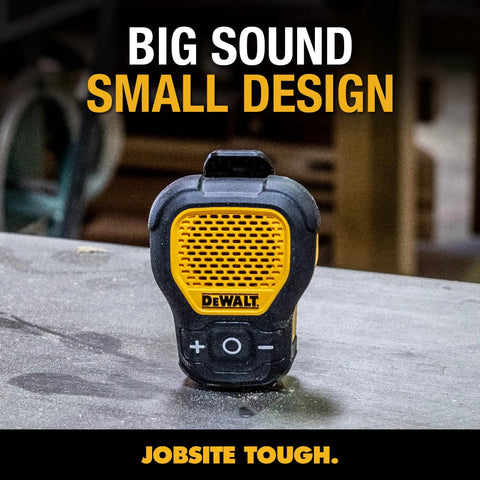 Wearable Clip On Bluetooth Speaker For Job Sites, Water Resistant Portable Speaker With Built In Mic For Hands Free Music And Calls, Rugged Yellow Clip On Design With Pro Audio Sound on a workshop table.