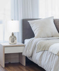Bedroom setup with Smokey Gray Glass Dome Table Lamp With White Fabric Drum Shade on bedside table.