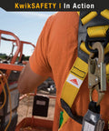 Rock Solid Full Body Safety Harness Built Tough For Daily Construction Work Meets Osha Standards worn by worker on high-rise site.