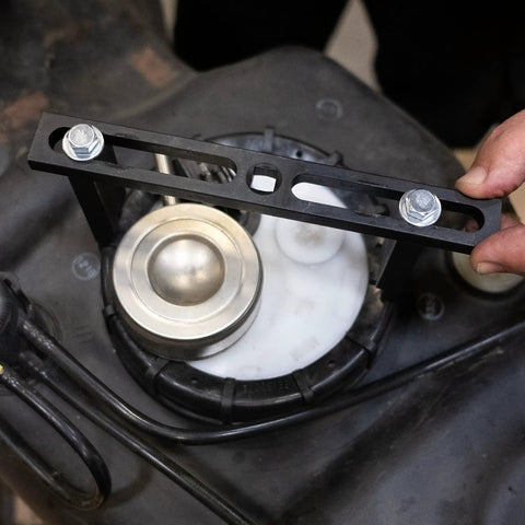 Fuel Pump Module Spanner Wrench With Adjustable Double Contact Grip for gas tank installation in use on retaining rings.
