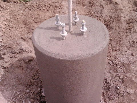 Concrete foundation with anchor bolts using Orange 24 Inch Bolt Template Tool For Nested 24 And 25 Inch Tubes.
