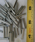Pile of Stainless Steel Roll Pins 3.30mm By 20mm Set Of 20 All-Purpose Hardware Fasteners Kit next to a measuring tape.