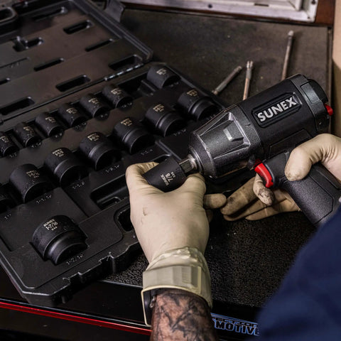 Mechanic using 1/2 Inch Drive Impact Socket Set, 19-Piece SAE, Cr-Mo Alloy Steel in heavy-duty case