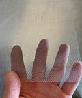 Hand holding Workhorse Stainless Steel Wire Mesh Screen 15.7 By 59 Inch 1mm Hole 20 Mesh Rust Resistant Durable Easy To Cut