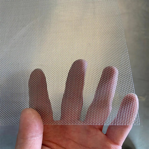 Hand holding Workhorse Stainless Steel Wire Mesh Screen 15.7 By 59 Inch 1mm Hole 20 Mesh Rust Resistant Durable Easy To Cut