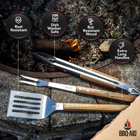 Three Piece BBQ Grillin Accessories Set With Heavy Duty Stainless Steel Tools And Solid Hardwood Handles Tongs Spatula Fork Kit For Grilling Like A Pro Gift shown on a grill
