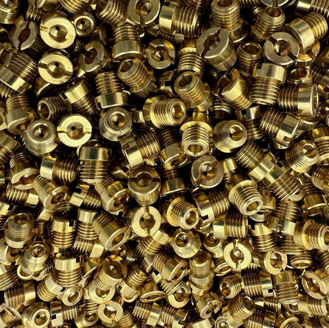 Main Jet Kit For One Quarter Inch By Thirty Two Carbs With Brass CNC Machined Jets Sizes 50 Through 59 Two Pieces Each Total 20 Jets Great For Holley Style Carburetors And Precision Tuning, showing a pile of brass jets