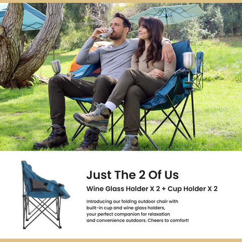 Couple sitting on Portable Folding Double Duo Camping Chair Loveseat For Two With Extra Cozy Padding And Wine Glass Holders.