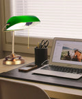 Morgan Antique Green LED Bankers Desk Lamp With Adjustable Arm on a study desk beside a laptop and stationery.