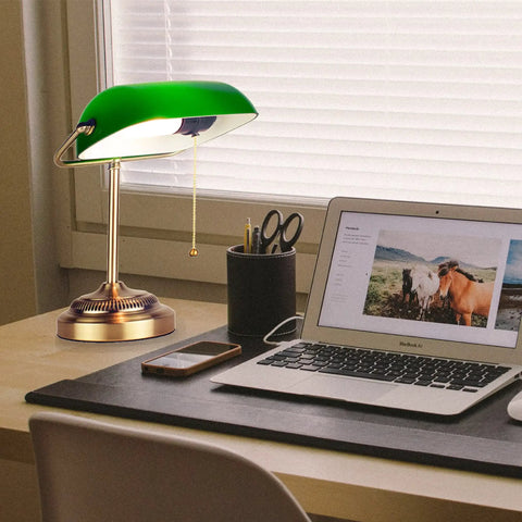 Morgan Antique Green LED Bankers Desk Lamp With Adjustable Arm on a study desk beside a laptop and stationery.