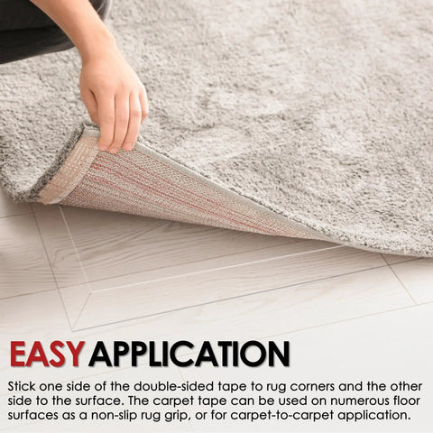 Person applying Heavy Duty Double Sided Rug Tape Non Slip Rug Gripper For Hardwood Floors Tile And Carpets 2 Inch By 20 Yards