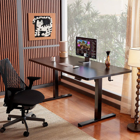 Electric Height Adjustable Sit Stand Desk 48 By 24 Inches with Memory Presets in black, ergonomic setup with chair and monitor