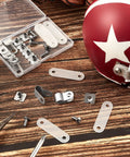 32 Piece Helmet Repair Kit with R Clips, Screws, Nuts, Rubber Gaskets next to red helmet on wooden surface