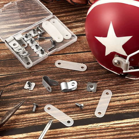 32 Piece Helmet Repair Kit with R Clips, Screws, Nuts, Rubber Gaskets next to red helmet on wooden surface
