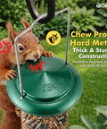 Squirrel attempting to chew a Six Port Metal Bird Feeder With Heavy Duty All Metal Construction 15 Inch Hanging Seed Feeder