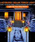 Solar Torch Light With Flickering Flame For Outdoor Yards And Gardens Large IP65 Waterproof Tiki Torches illuminating snowy path