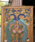 Handcrafted Wooden Sliding Barn Door With Peacock And Floral Design For Rustic Farmhouse Cabin Decor Hand Painted Distressed Wood Door For Mountain And Lake Homes, featuring detailed peacock carvings.