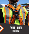 Back view of Razorback Elite Safety Harness with lightweight build, sewn-in belt, sternal D-rings on a worker at a construction site.