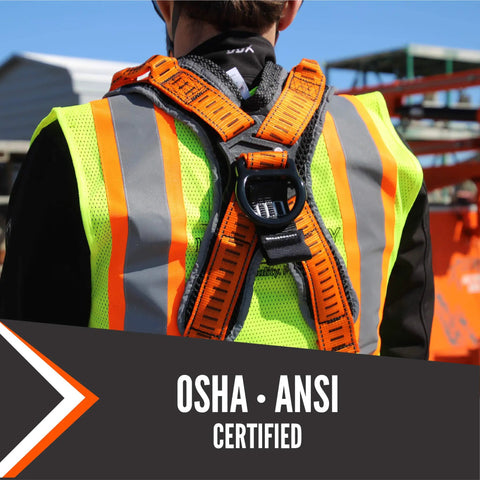 Back view of Razorback Elite Safety Harness with lightweight build, sewn-in belt, sternal D-rings on a worker at a construction site.