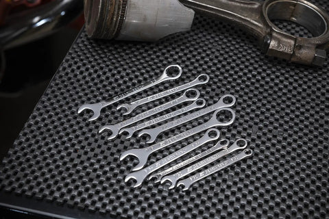 Ten Piece SAE Midget Wrench Set With 12 Point Box End And 6 Point Box End, Alloy Steel Construction, lying on textured surface