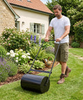 Man using Heavy Duty 23 Inch Lawn Roller With 13 Gallon Water Or Sand Fill Push And Tow Behind Yard Roller With U Handle outdoors