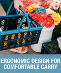 Person carrying Collapsible Grocery Baskets With Handles 24L Ocean, 3 Pack, Grab-And-Go Trunk Ready Space Saving Bins filled with flowers.
