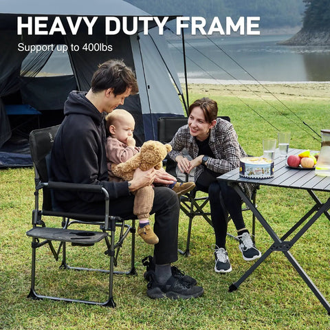 Family sitting outside on a black Compact Foldable Camping Directors' Chair With Side Table And Pocket, next to a foldable table.
