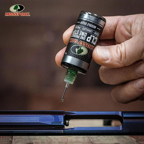 Applying Mossy Oak All In One Gun Cleaning Oil CLP For Firearms Clean Lubricate And Protect In One Step with needle oiler