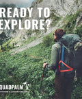 Hiker with backpack in lush green mountain landscape, Foldable Stainless Steel Grappling Hook attached to pack, exploring outdoors.