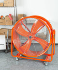 Smooth Rolling Industrial Drum Fan Cranking Out Serious Airflow To Crush Heat And Clear Smoke Quick 15000 Cfm Motor Works Hard All Day Long For Workers in an orange finish.