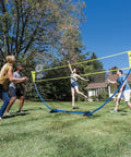 Backyard Badminton Set With Easy Setup Net 4 Steel Shaft Rackets 2 Durable Shuttlecocks in use during outdoor family fun